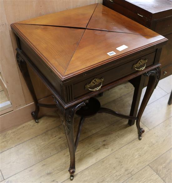 An Edwardian mahogany envelope card table W.56cm